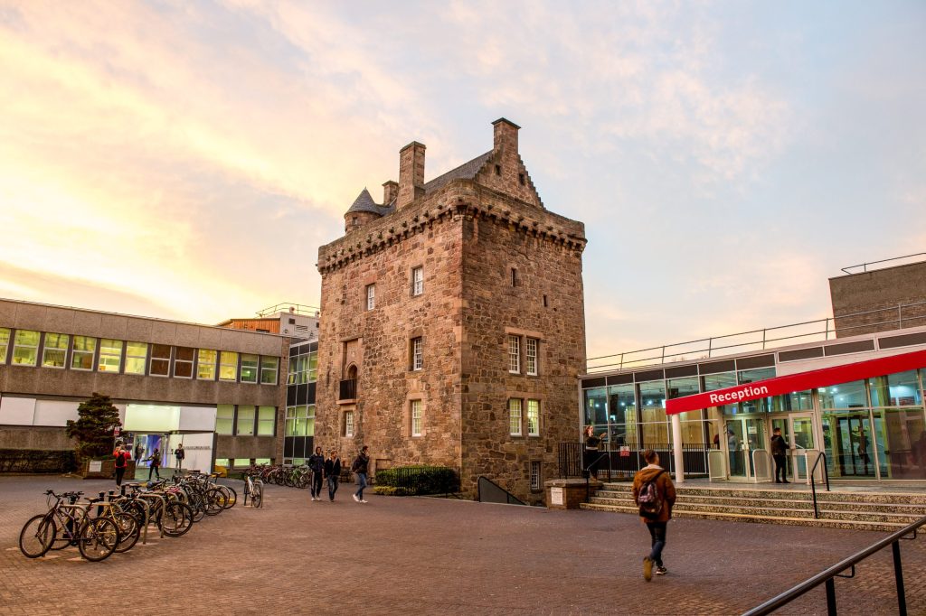 Merchiston exterior at dusk - ENU